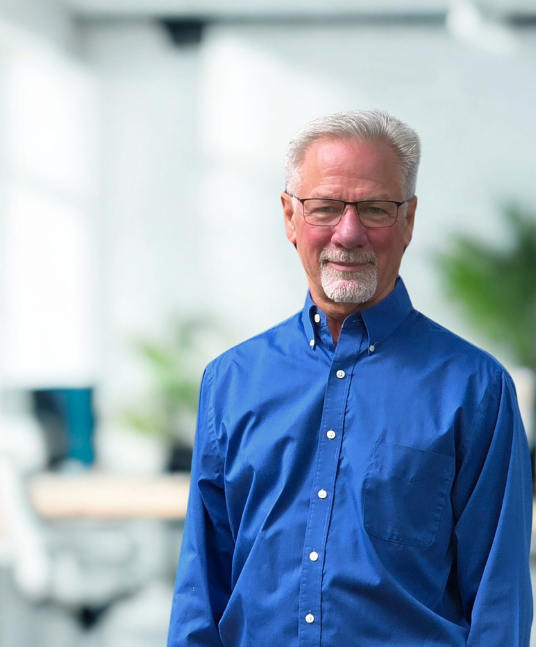 Smiling man in blue shirt
